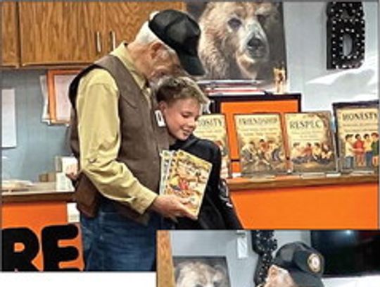 Former Hooks resident comes home to share books with local students